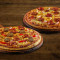 Deux Pizzas Moyennes Spéciales Non Végétariennes.