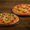 Deux Pizzas Moyennes Spéciales-Légumes.