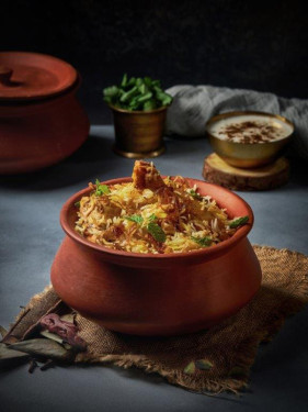 Dum Biryani (Chicken) Served With Raita Salad