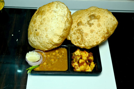Punjabi Concoction Of Spicy Curried Chole Puffy Fried