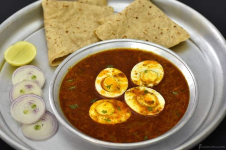 Achari Egg Curry- 5 Chapati/ 2 Paratha/ Jeera Rice( 2 Eggs)