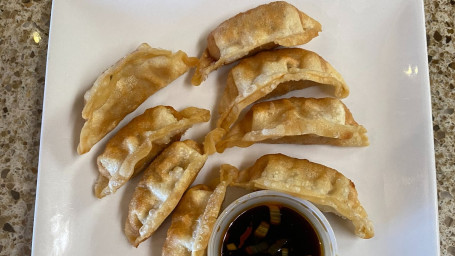 A12. Pork Dumplings (8)