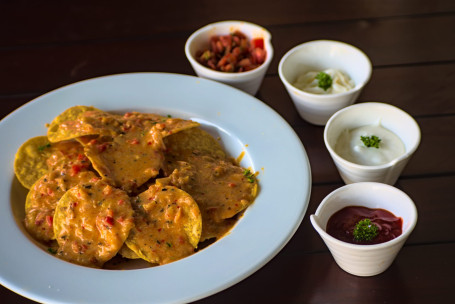 Nachos With Cheese Fondue And Spicy Salsa