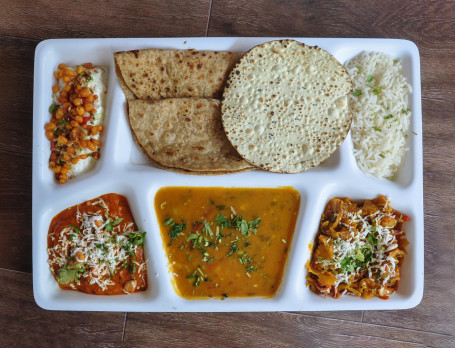 Punjabi Deluxe Thali [Paneer Vegetable Vegetable Curry Dal Rice Roti (2 Pcs) Raita Papad Salad Buttermilk Sweet]