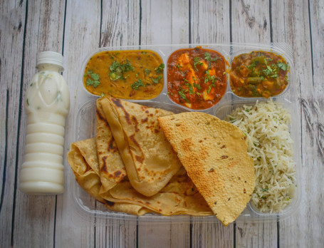 Golden Punjabi Thali With Buttermilk (1 Paneer Sabji Or Veg Sabji 4 Butter Roti 1 Special Biryani Salad 1 Buttermilk Achar Sweet Mukhwash)