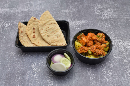 Homely Aloo Gobhi Masala With Choice Of Rotis Salad