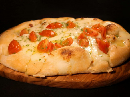 Garlic pizza bread with cherry tomatoes