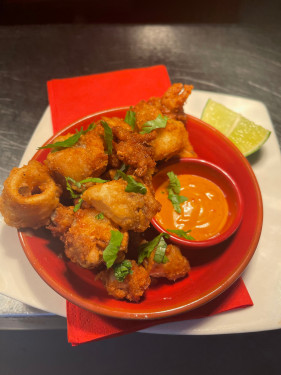 Calamari Served With Chipotle Sauce.