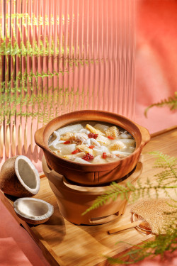 Zhú Shēng Yē Zi Jī Wō Braised Chicken Soup With Fresh Coconut And Bamboo Fungus In Pot