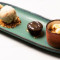 Café gourmand : mousse chocolat blanc, pomme caramel isigny, glace vanille macadamia, fondant choco