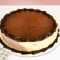 (8-12 Servings) Round all ice cream cake topped with fudge.