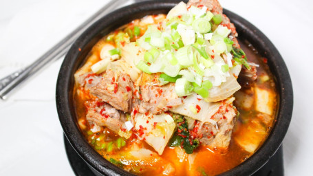 61. Kimchi Stewed On Hot Spicy Broth With Pork, Sliced Tofu, And Vegetables