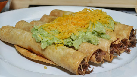 Five Rolled Tacos With Guacamole And Cheese